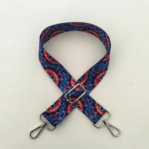 Detail of No. 57 silver buckle and geometric ethnic pattern on adjustable bag strap