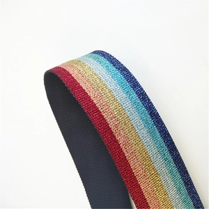 Detail of wide ethnic style crossbody strap with colorful metallic glitter woven patterns