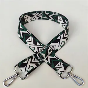 Macro detail of geometric ethnic strap pattern with silver lobster clasp and slider