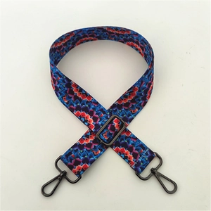 Detailed shot of ethnic geometric pattern strap with gunmetal swivel snap hooks