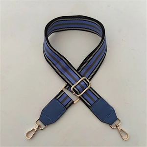 Adjustable striped woven replacement bag strap with blue leather ends and gold metal hooks