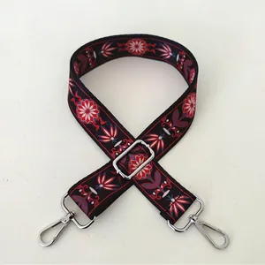 Ethnic style wide adjustable shoulder strap with red blue floral weave and silver buckles