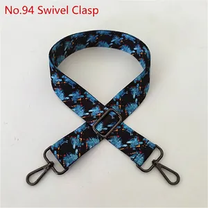 Detail of adjustable blue and black ethnic floral strap with gunmetal swivel hooks