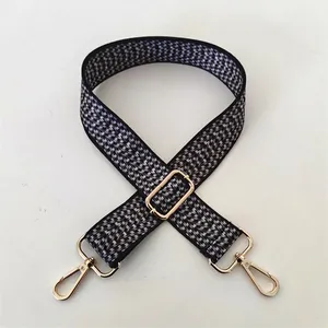 Detail of Style No.99 adjustable black and white geometric pattern strap with gold hardware