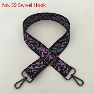 Close-up of geometric woven replacement bag strap with grey metallic swivel hooks