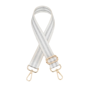 Close-up of adjustable white bag strap with silver glitter stripes and gold metal hooks