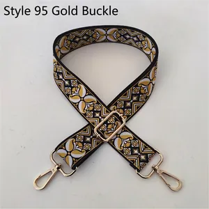 Close-up of ethnic geometric jacquard bag strap with gold metal buckle and adjuster