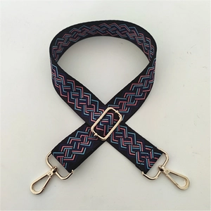 Detail of adjustable wide shoulder strap with ethnic pink and blue geometric pattern