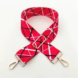 Detail of red geometric strap with adjustable gold hardware for DIY handbags