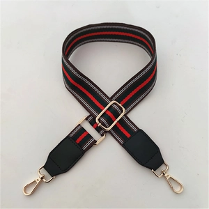 Adjustable green and red striped woven bag strap with golden metal swivel hooks