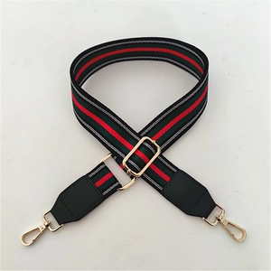Adjustable wide replacement strap with red and green stripes and gold hardware