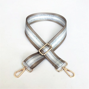 Adjustable khaki webbed shoulder strap with silver glitter and gold metal hardware