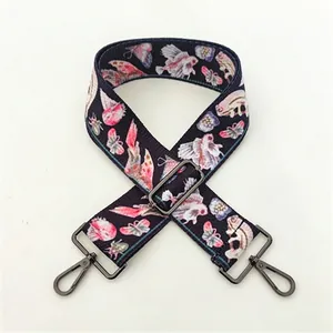 Detailed macro view of high-density colorful fish pattern strap with dark metal buckle