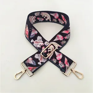Detail of wide adjustable purse strap with nature pattern and gold clasp 03