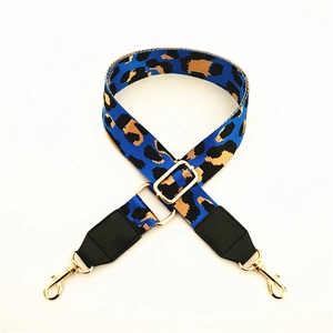 Macro detail of blue leopard print replacement strap with golden metal lobster clasps