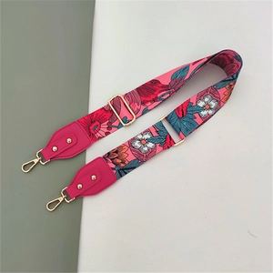 Adjustable wide replacement shoulder strap with pink floral pattern and gold metal hooks
