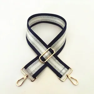 Detail of wide navy stripe strap with silver glitter and golden metal lobster clasps