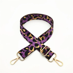 Purple and gold leopard print crossbody bag strap with polished gold hardware buckles