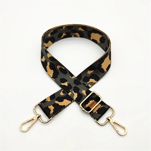 Detail of adjustable leopard print bag strap with premium gold metal lobster clasps