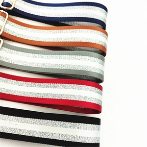Adjustable woven purse straps in five colors with metallic silver stripes and gold buckles