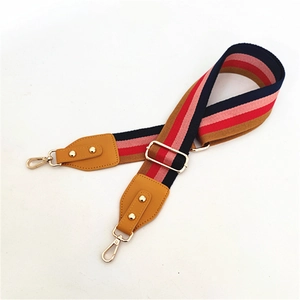 Adjustable colorful striped nylon bag strap with leather ends and gold metal hardware