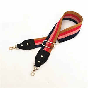 Adjustable colorful striped woven bag strap with golden metal hooks and black leather ends