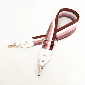 Adjustable wide replacement bag strap with pink and brown stripes and gold hardware