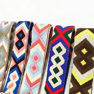Detailed view of bohemian style woven bag straps with colorful geometric diamond patterns