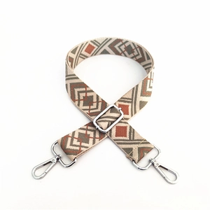 Ethnic bohemian style woven shoulder strap with geometric diamond patterns and silver clips