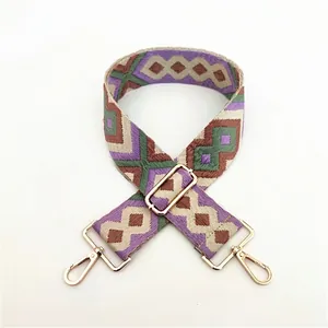 Detailed weave of ethnic colorful replacement shoulder strap with gold metal buckle