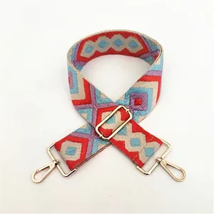Ethnic style woven replacement bag strap with red and blue geometric patterns and gold clips
