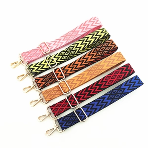 Adjustable ethnic style woven bag straps with geometric patterns and gold metal buckles