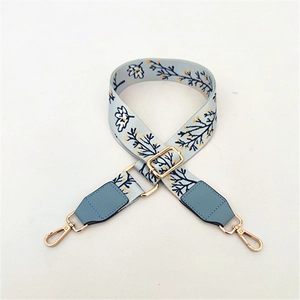 Adjustable light blue floral strap for handbags with golden metal hooks and buckles