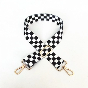 Adjustable checkerboard canvas bag strap with gold metal swivel hooks and buckles