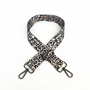 Adjustable leopard print strap with dark gunmetal hooks for crossbody bags