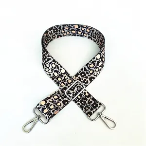 Adjustable leopard print shoulder strap with silver metal hooks for crossbody bags