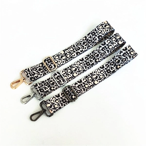 Adjustable leopard print bag strap with metal hooks in gold, silver, and black finish