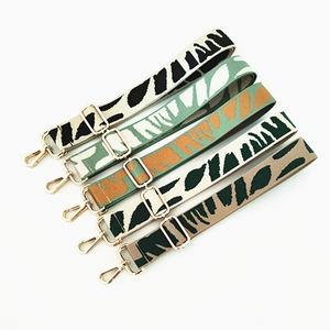 Detail of adjustable animal print bag straps with gold metal hooks in five colors