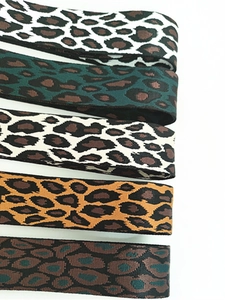 Detail of five adjustable leopard print replacement straps in various color patterns