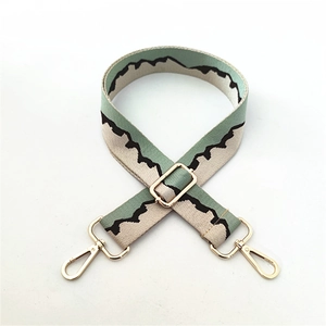 Adjustable wide jacquard bag strap with wave pattern and gold-tone metal hooks