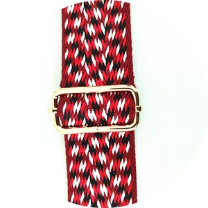 Close-up of thickened colorful wide jacquard shoulder strap with gold metal buckle