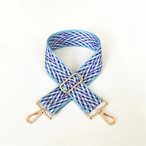 Adjustable wide woven bag strap with blue jacquard pattern and golden metal buckles
