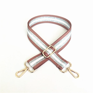 Adjustable mauve canvas shoulder strap with silver glitter stripes and gold hardware