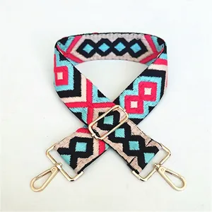 Ethnic embroidery shoulder strap with colorful geometric patterns and gold metal clips