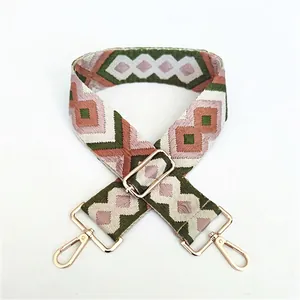 Ethnic wide woven bag strap with geometric patterns and adjustable golden metal buckles