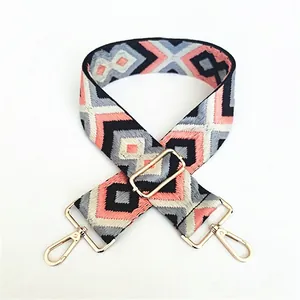 Ethnic wide woven shoulder strap with geometric diamond pattern and gold metal hardware