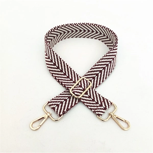Adjustable burgundy and cream chevron woven shoulder strap with gold metal buckles