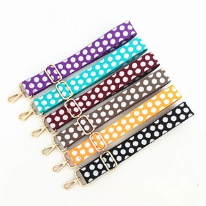 Detailed view of adjustable polka dot replacement straps with gold metal clasps in six colors