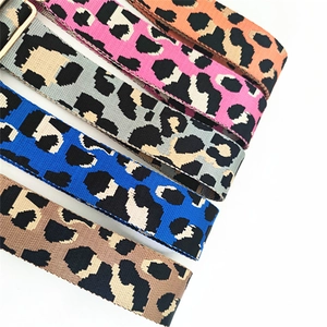 Detailed view of adjustable leopard print wide bag straps in five colors with gold buckles