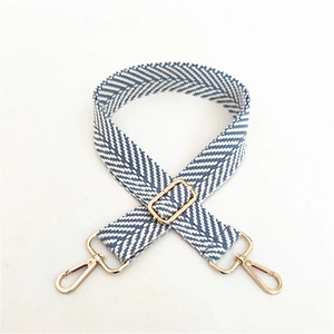 Blue and white herringbone wide canvas shoulder strap with gold metal buckles